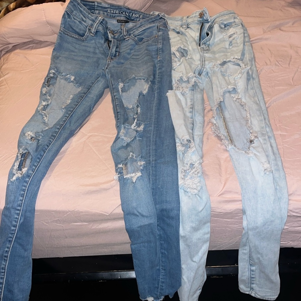 I am selling 2 pairs of American Eagle jeans One pair is a Darkish/light blue65$